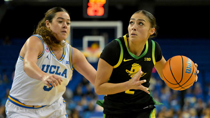 Dec 7, 2025; Los Angeles, California, USA; Oregon Ducks guard Katie Fiso (2) drives past UCLA Bruins guard Charlisse Leger-Walker (5) during the first half at Pauley Pavilion presented by Wescom Financial. Mandatory Credit: Jayne Kamin-Oncea-Imagn Images Dec 7, 2025; Los Angeles, California, USA; Oregon Ducks guard Katie Fiso (2) drives past UCLA Bruins guard Charlisse Leger-Walker (5) during the first half at Pauley Pavilion presented by Wescom Financial. Mandatory Credit: Jayne Kamin-Oncea-Imagn Images