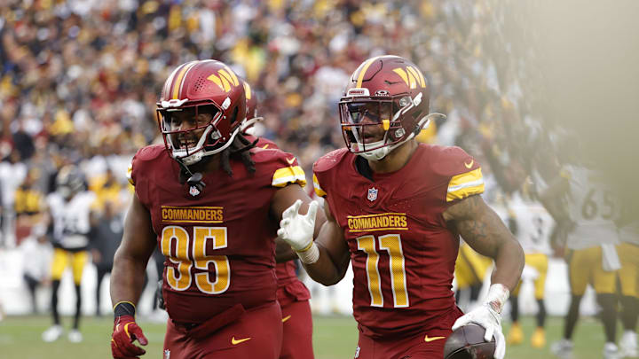 Nov 10, 2024; Landover, Maryland, USA; Washington Commanders safety Jeremy Chinn (11) celebrates after intercepting a pass against the Pittsburgh Steelers during the second half at Northwest Stadium. Mandatory Credit: Amber Searls-Imagn Images