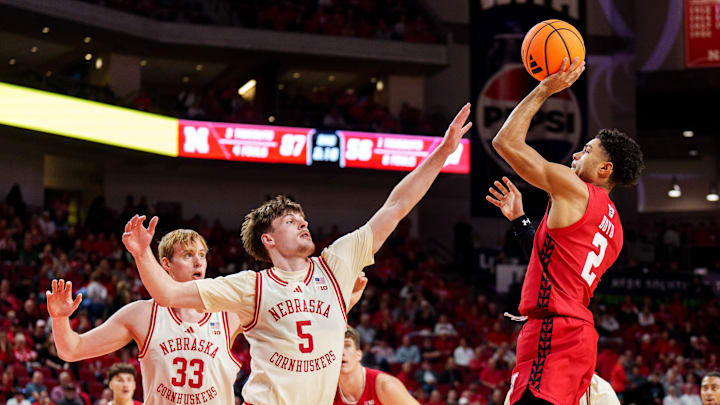 Dec 10, 2025; Lincoln, Nebraska, USA; Wisconsin Badgers guard Nick Boyd (2) shoots the ball against Nebraska Cornhuskers forward Braden Frager (5) and forward Leo Curtis (33) during the second half at Pinnacle Bank Arena. Dec 10, 2025; Lincoln, Nebraska, USA; Wisconsin Badgers guard Nick Boyd (2) shoots the ball against Nebraska Cornhuskers forward Braden Frager (5) and forward Leo Curtis (33) during the second half at Pinnacle Bank Arena.