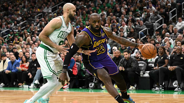 Mar 8, 2025; Boston, Massachusetts, USA; Los Angeles Lakers forward LeBron James (23) drives to the basket against Boston Celtics guard Derrick White (9) during the first quarter at the TD Garden. Mandatory Credit: Brian Fluharty-Imagn Images