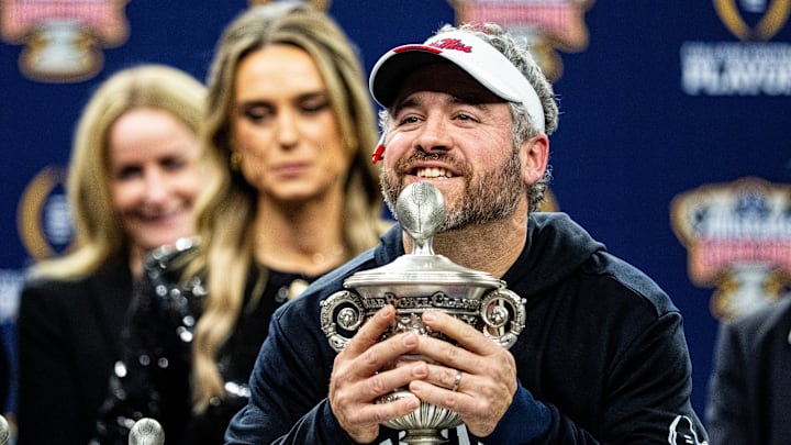 Ole Miss head coach Pete Golding lifts the Sugar Bowl trophy after the Sugar Bowl and College Football Playoff quarterfinals at Caesars Superdome in New Orleans, La., on Thursday, Jan. 1, 2026. Ole Miss defeated Georgia 39-34.