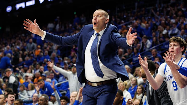 Feb 11, 2025; Lexington, Kentucky, USA; Kentucky Wildcats head coach Mark Pope reacts to a call by a referee during the second half against the Tennessee Volunteers at Rupp Arena at Central Bank Center. Mandatory Credit: Jordan Prather-Imagn Images Feb 11, 2025; Lexington, Kentucky, USA; Kentucky Wildcats head coach Mark Pope reacts to a call by a referee during the second half against the Tennessee Volunteers at Rupp Arena at Central Bank Center. Mandatory Credit: Jordan Prather-Imagn Images