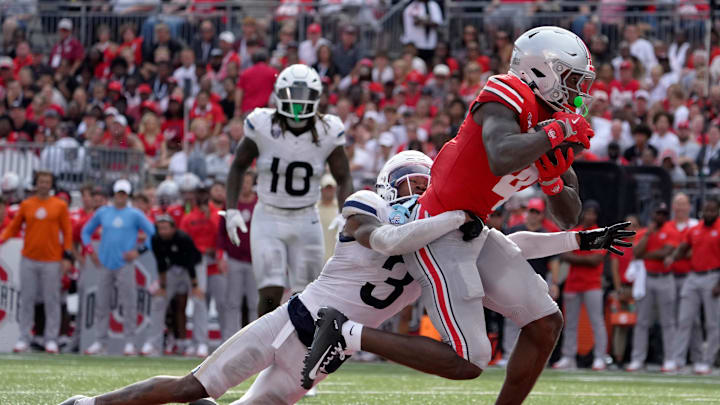 August 31, 2024; Columbus, Ohio, USA;
Ohio State Buckeyes wide receiver Jeremiah Smith (4) is tackled in the endzone by Akron Zips cornerback Devonte Golden-Nelson (3) to score his second touchdown of the half during the first half of Saturday’s NCAA Division I football game at Ohio Stadium.