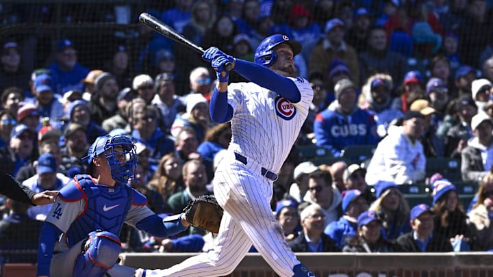Apr 5, 2024; Chicago, Illinois, USA; Chicago Cubs first base Michael Busch (29) hits a solo home run