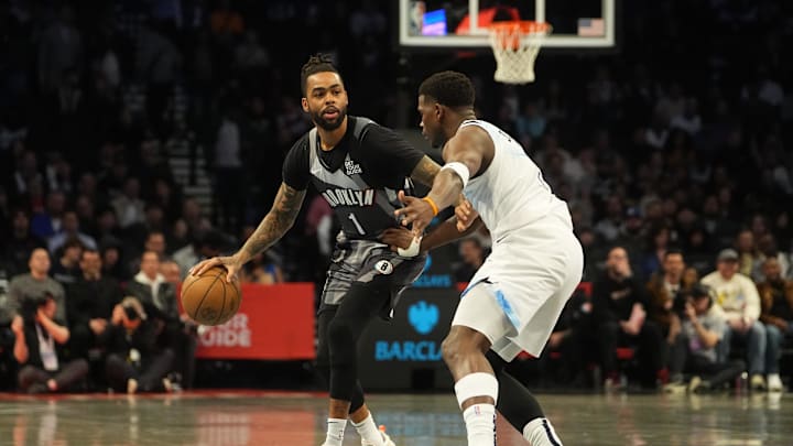 Apr 3, 2025; Brooklyn, New York, USA; Brooklyn Nets guard D'Angelo Russell (1) dribbles the ball against Minnesota Timberwolves shooting guard Anthony Edwards (5) during the first half at Barclays Center. Mandatory Credit: Gregory Fisher-Imagn Images Apr 3, 2025; Brooklyn, New York, USA; Brooklyn Nets guard D'Angelo Russell (1) dribbles the ball against Minnesota Timberwolves shooting guard Anthony Edwards (5) during the first half at Barclays Center. Mandatory Credit: Gregory Fisher-Imagn Images