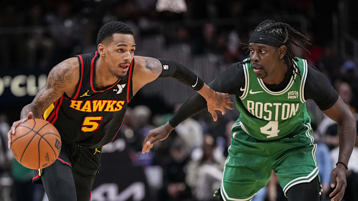 Mar 28, 2024; Atlanta, Georgia, USA; Atlanta Hawks guard Dejounte Murray (5) dribbles against Boston