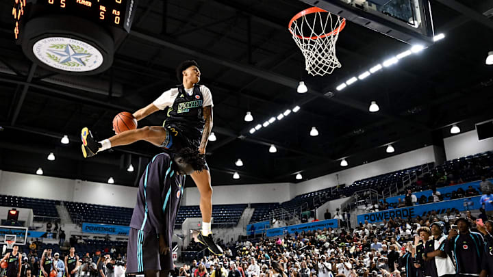 Apr 1, 2024; Houston, TX, USA; McDonalds High School All American guard Jalil Bethea (1) jumps over