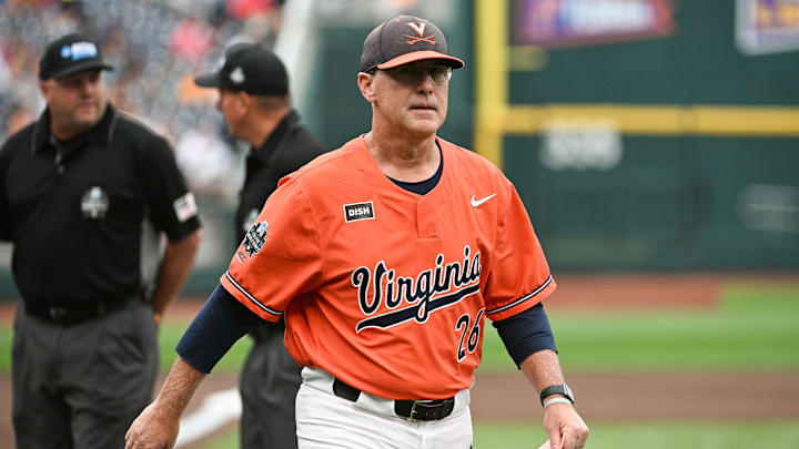 Jun 16, 2023; Omaha, NE, USA;  Virginia Cavaliers head coach Brian O'Connor leaves the meeting with the umpires before the game against the Florida Gators at Charles Schwab Field Omaha. Mandatory Credit: Steven Branscombe-Imagn Images