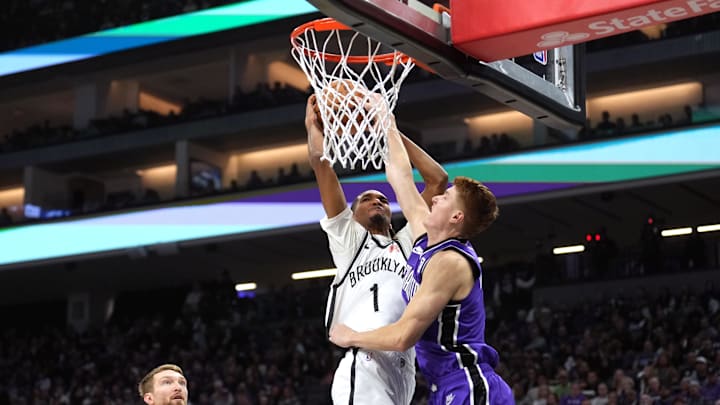 Nov 24, 2024; Sacramento, California, USA; Brooklyn Nets forward Ziaire Williams (1) shoots against Sacramento Kings guard Kevin Huerter (right) during the second quarter at Golden 1 Center. Mandatory Credit: Darren Yamashita-Imagn Images
