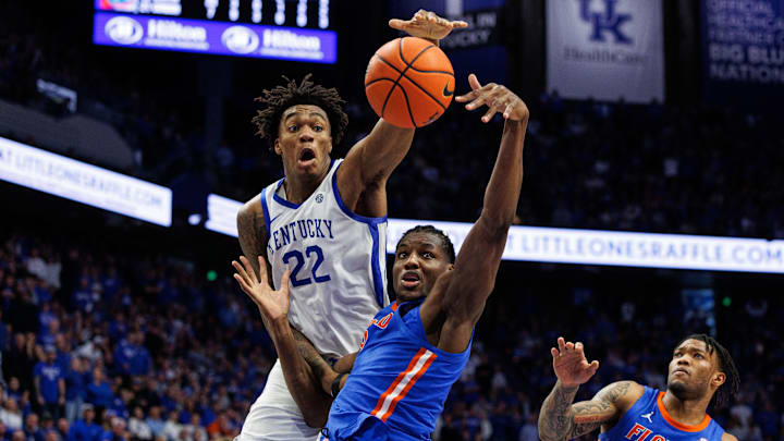 Jan 4, 2025; Lexington, Kentucky, USA; Florida Gators center Rueben Chinyelu (9) and Kentucky Wildcats center Amari Williams (22) reach for a rebound during the second half at Rupp Arena at Central Bank Center. Mandatory Credit: Jordan Prather-Imagn Images