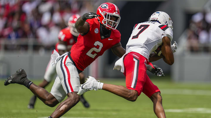 Sep 9, 2023; Athens, Georgia, USA; Georgia Bulldogs linebacker Smael Mondon Jr. (2) moves in to tackle Ball State Cardinals wide receiver Malcolm Gillie (7) during the first half at Sanford Stadium. Mandatory Credit: Dale Zanine-Imagn Images