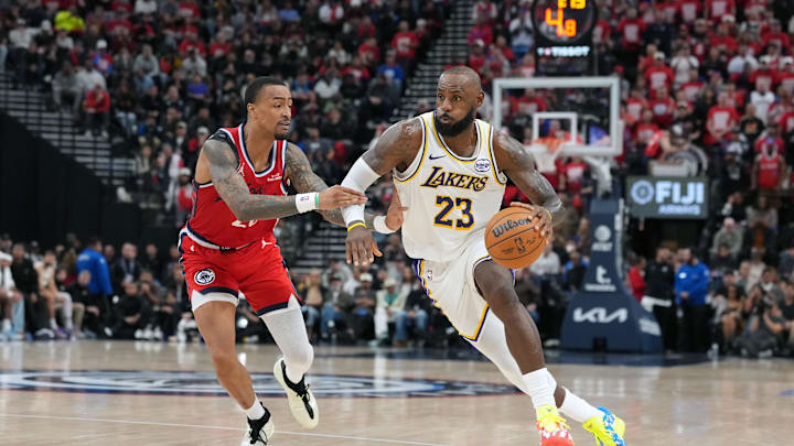 Dec 20, 2025; Inglewood, California, USA; Los Angeles Lakers forward Lebron James (23) is defended by LA Clippers forward John Collins (20) in the second half at Intuit Dome. Mandatory Credit: Kirby Lee-Imagn Images
