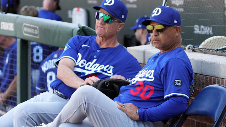 Feb 21, 2025; Mesa, Arizona, USA; Los Angeles Dodgers manager Dave Roberts (30) gets ready for a spring training game against the Chicago Cubs at Sloan Park. Mandatory Credit: Rick Scuteri-Imagn Images