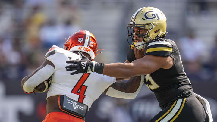 Sep 30, 2023; Atlanta, Georgia, USA; Georgia Tech Yellow Jackets linebacker Charles Rosser (13) tackles Bowling Green Falcons running back Terion Stewart (4) during the first half at Hyundai Field. Mandatory Credit: Dale Zanine-Imagn Images