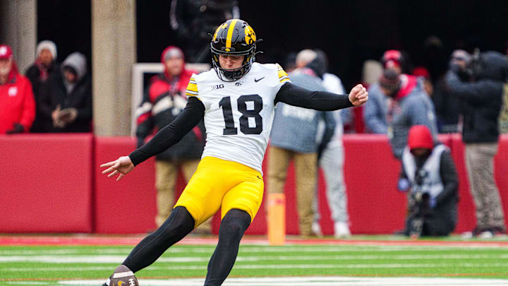 Nov 28, 2025; Lincoln, Nebraska, USA; Iowa Hawkeyes kicker Drew Stevens (18) kicks off to start the game against the Nebraska Cornhuskers at Memorial Stadium. Mandatory Credit: Dylan Widger-Imagn Images