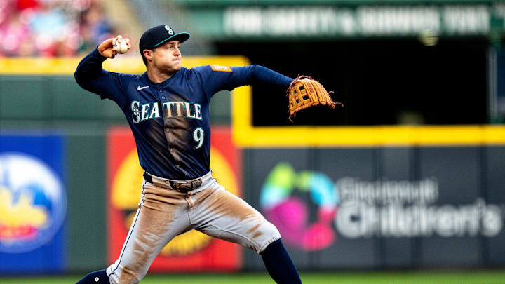 Seattle Mariners third baseman Ben Williamson (9) throws out Cincinnati Reds first baseman Christian Encarnacion-Strand (33) in the third inning of the MLB game between Cincinnati Reds and Seattle Mariners at Great American Ball Park in Cincinnati on Wednesday, April 16, 2025.