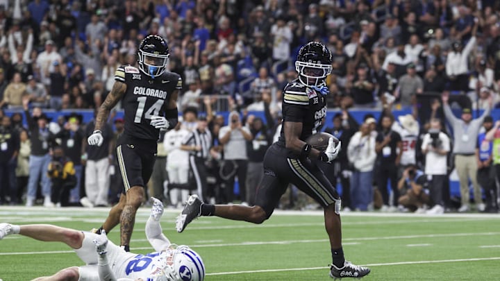 Colorado Buffaloes wide receiver Travis Hunter runs with the ball and scores a touchdown Colorado Buffaloes wide receiver Travis Hunter runs with the ball and scores a touchdown