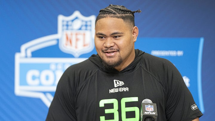 University of Arizona offensive lineman Jonah Savaiinaea (OL36) answers questions at a press conference during the 2025 NFL Combine at Indiana Convention Center. 