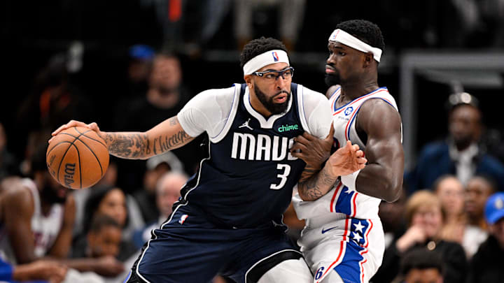 Jan 1, 2026; Dallas, Texas, USA; Dallas Mavericks forward Anthony Davis (3) looks to move the ball past Philadelphia 76ers center Adem Bona (30) during the second half at the American Airlines Center. Mandatory Credit: Jerome Miron-Imagn Images