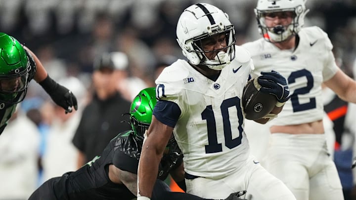 Penn State Nittany Lions running back Nicholas Singleton rushes up the field against Oregon in the Big Ten Championship Game at Lucas Oil Stadium.