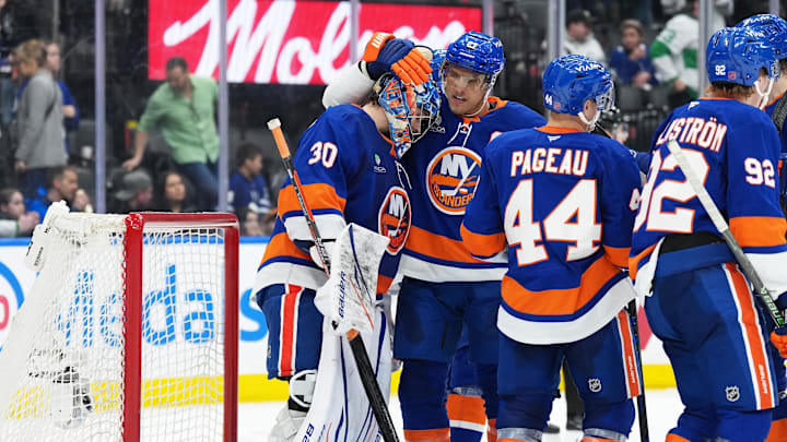 Mar 17, 2026; Toronto, Ontario, CAN; New York Islanders left wing Anders Lee (27) celebrates the win with goaltender Ilya Sorokin (30) against the Toronto Maple Leafs at the end of the third period at Scotiabank Arena. Mandatory Credit: Nick Turchiaro-Imagn Images