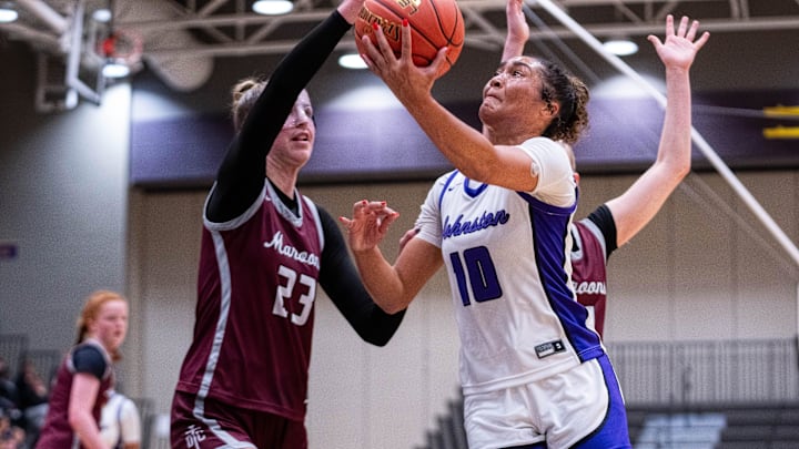 Johnston's Jenica Lewis (10) takes a shot near the basket against Dowling Catholic on Dec. 16, 2025, at Johnston High School.