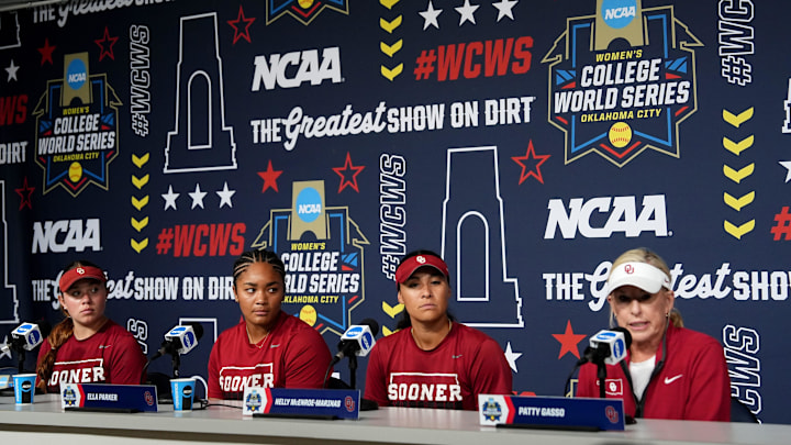 Oklahoma's Gabbie Garcia (42), Ella Parker (5), Nelly McEnroe-Marinas (2) and head coach Patty Gasso speak during media and practice day for the Women's College World Series at Devon Park in Oklahoma City, Wednesday, May, 28, 2025.