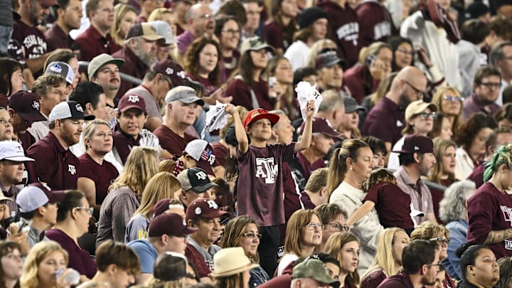 Nov 16, 2024; College Station, Texas, USA; A young fan cheers during the second half of the game between the Texas A&M Aggies and the New Mexico State Aggies at Kyle Field. Mandatory Credit: Maria Lysaker-Imagn Images 