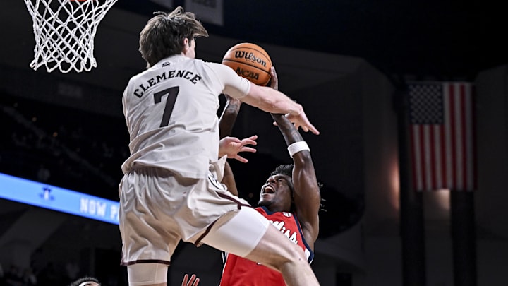 Feb 18, 2026; College Station, Texas, USA; Ole Miss Rebels guard AJ Storr (2) is fouled by Texas A&M Aggies forward Zach Clemence (7) during the first half at Reed Arena. Mandatory Credit: Maria Lysaker-Imagn Images 