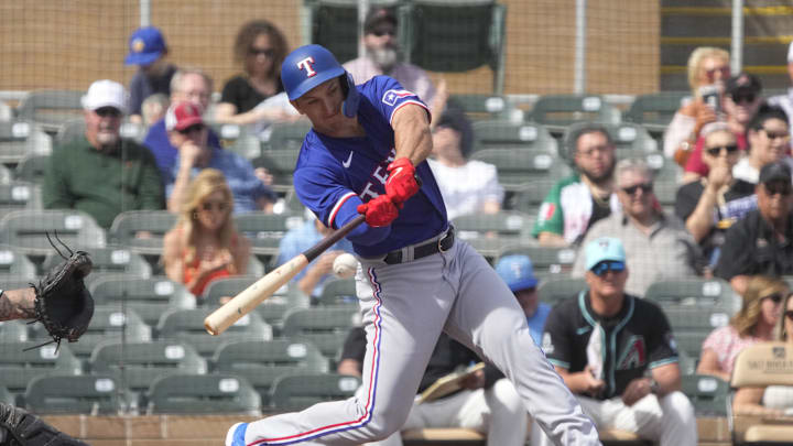 Feb 27, 2024; Salt River Pima-Maricopa, Arizona, USA; Texas Rangers left fielder Wyatt Langford (82)