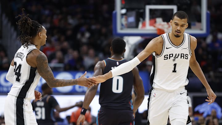 Feb 23, 2026; Detroit, Michigan, USA;  San Antonio Spurs forward Victor Wembanyama (1) receives congratulations from guard Devin Vassell (24) in the second half against the Detroit Pistons at Little Caesars Arena. Mandatory Credit: Rick Osentoski-Imagn Images