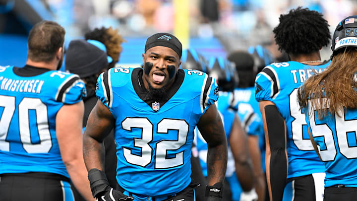 Oct 26, 2025; Charlotte, North Carolina, USA; Carolina Panthers linebacker Trevin Wallace (32) runs on to the field before the game at Bank of America Stadium. Mandatory Credit: Bob Donnan-Imagn Images