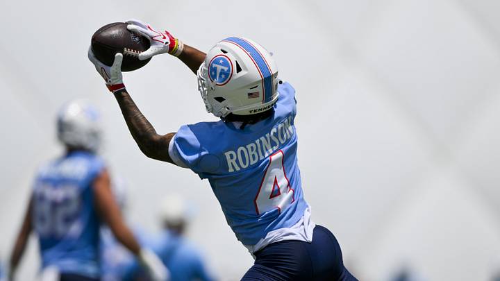 Jun 16, 2026; Nashville, TN, USA;  Tennessee Titans wide receiver Wan'Dale Robinson (4) makes a catch during day 1 of mini-camp at Vanderbilt Health Football Center. Mandatory Credit: Steve Roberts-Imagn Images