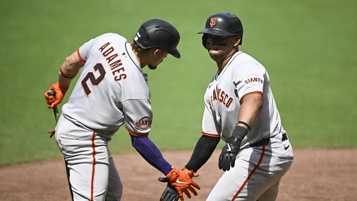 Aug 21, 2025; San Diego, California, USA; San Francisco Giants designated hitter Rafael Devers (16) is congratulated by San Francisco Giants shortstop Willy Adames (2) after hitting a solo home run during the sixth inning against the San Diego Padres at Petco Park. Mandatory Credit: Denis Poroy-Imagn Images
