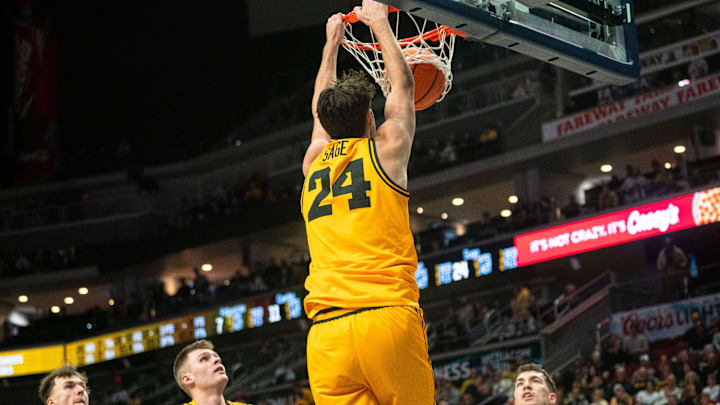 Iowa's Tate Sage dunks the ball during a game at Casey's Center on Saturday, Dec. 20, 2025 in Des Moines.