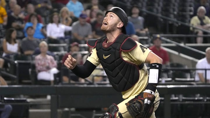 Arizona Diamondbacks catcher Carson Kelly (18) runs after a foul ball at Chase Field in Arizona.
