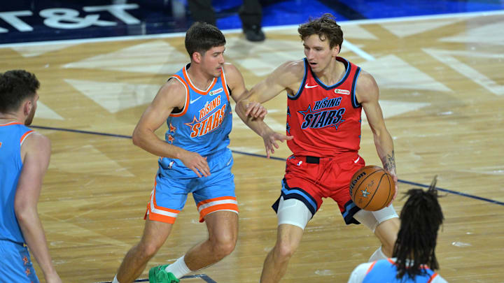 Feb 13, 2026; Inglewood, California, USA; Team Melo guard Reed Sheppard (15) of the Houston Rockets defends against Team Vince frontcourt Matas Buzelis (14) of the Chicago Bulls during an NBA All Star Rising Stars championship game at Intuit Dome. Mandatory Credit: Jayne Kamin-Oncea-Imagn Images
