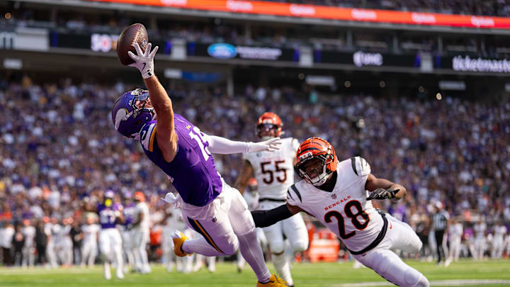 Sep 21, 2025; Minneapolis, Minnesota, USA; Minnesota Vikings wide receiver Adam Thielen (19) is unable to make the catch as Cincinnati Bengals cornerback Josh Newton (28) defends during the first half at U.S. Bank Stadium. Mandatory Credit: Brad Rempel-Imagn Images