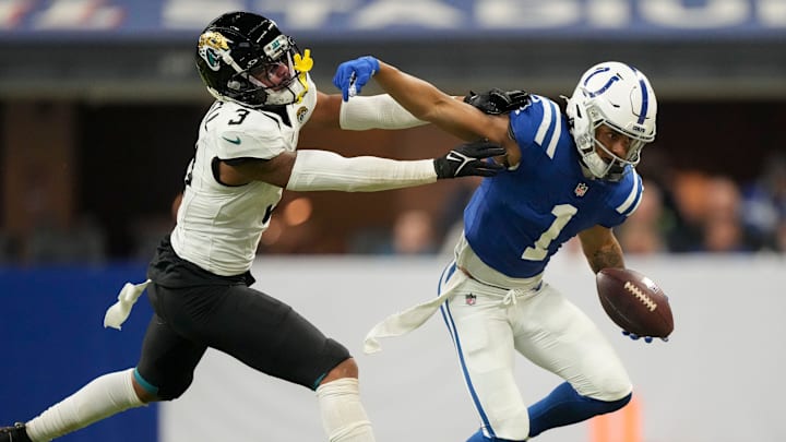 Indianapolis Colts wide receiver Josh Downs (1) reaches to push off Jacksonville Jaguars cornerback Tyson Campbell (3) on Sunday, Jan. 5, 2025, during a game against the Jacksonville Jaguars at Lucas Oil Stadium in Indianapolis.
