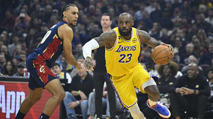Jan 28, 2026; Cleveland, Ohio, USA; Cleveland Cavaliers guard Jaylon Tyson (20) defends Los Angeles Lakers forward LeBron James (23) in the first quarter at Rocket Arena. Mandatory Credit: David Richard-Imagn Images