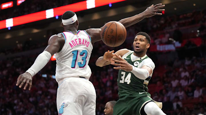 Apr 5, 2025; Miami, Florida, USA; Milwaukee Bucks forward Giannis Antetokounmpo (34) passes the ball under the arm of Miami Heat center Bam Adebayo (13) during overtime at Kaseya Center. Mandatory Credit: Jim Rassol-Imagn Images Apr 5, 2025; Miami, Florida, USA; Milwaukee Bucks forward Giannis Antetokounmpo (34) passes the ball under the arm of Miami Heat center Bam Adebayo (13) during overtime at Kaseya Center. Mandatory Credit: Jim Rassol-Imagn Images