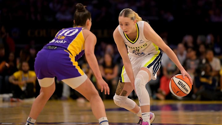 Sep 7, 2025; Los Angeles, California, USA; Los Angeles Sparks guard Kelsey Plum (10) defends Dallas Wings guard Paige Bueckers (5) as she drives to the basket during the first half at Crypto.com Arena. Mandatory Credit: Jayne Kamin-Oncea-Imagn Images Sep 7, 2025; Los Angeles, California, USA; Los Angeles Sparks guard Kelsey Plum (10) defends Dallas Wings guard Paige Bueckers (5) as she drives to the basket during the first half at Crypto.com Arena. Mandatory Credit: Jayne Kamin-Oncea-Imagn Images
