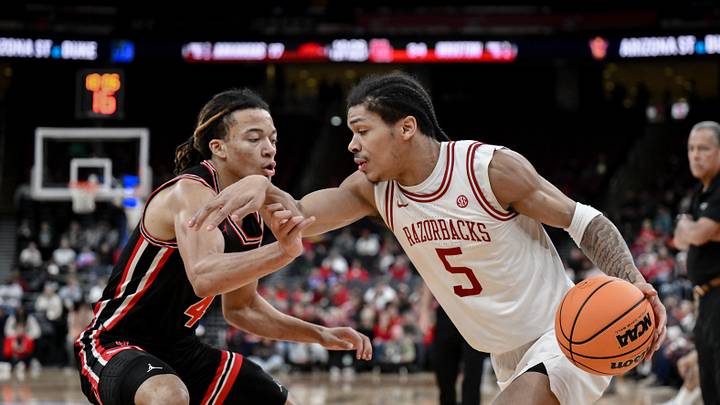 Dec 20, 2025; Newark, New Jersey, USA; Arkansas Razorbacks guard Darius Acuff Jr. (5) tries to drive past Houston Cougars guard Kingston Flemings (4) during the first half at Prudential Center. Mandatory Credit: John Jones-Imagn Images Dec 20, 2025; Newark, New Jersey, USA; Arkansas Razorbacks guard Darius Acuff Jr. (5) tries to drive past Houston Cougars guard Kingston Flemings (4) during the first half at Prudential Center. Mandatory Credit: John Jones-Imagn Images