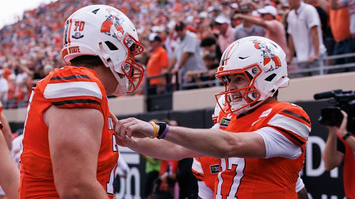 Oklahoma State Cowboys quarterback Drew Mestemaker celebrates with offensive line Shaun Torgeson. Oklahoma State Cowboys quarterback Drew Mestemaker celebrates with offensive line Shaun Torgeson.