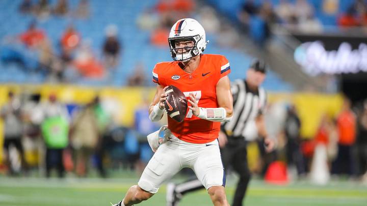 Sep 19, 2026; Charlotte, North Carolina, USA; Virginia Cavaliers quarterback Beau Pribula (7) rolls out to pass during the third quarter against the West Virginia Mountaineers at Bank of America Stadium. Mandatory Credit: Ben Queen-Imagn Images Sep 19, 2026; Charlotte, North Carolina, USA; Virginia Cavaliers quarterback Beau Pribula (7) rolls out to pass during the third quarter against the West Virginia Mountaineers at Bank of America Stadium. Mandatory Credit: Ben Queen-Imagn Images