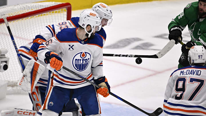 May 29, 2025; Dallas, Texas, USA; Edmonton Oilers defenseman Jake Walman (96) deflects the puck against the Dallas Stars during the third period in game five of the Western Conference Final of the 2025 Stanley Cup Playoffs at American Airlines Center. Mandatory Credit: Jerome Miron-Imagn Images