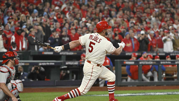 Oct 8, 2022; St. Louis, Missouri, USA; St. Louis Cardinals designated hitter Albert Pujols (5) hits a single in the eighth inning against the Philadelphia Phillies during game two of the Wild Card series for the 2022 MLB Playoffs at Busch Stadium. Mandatory Credit: Jeff Curry-Imagn Images Oct 8, 2022; St. Louis, Missouri, USA; St. Louis Cardinals designated hitter Albert Pujols (5) hits a single in the eighth inning against the Philadelphia Phillies during game two of the Wild Card series for the 2022 MLB Playoffs at Busch Stadium. Mandatory Credit: Jeff Curry-Imagn Images