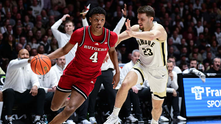 Mar 4, 2025; West Lafayette, Indiana, USA;  Rutgers Scarlet Knights guard Ace Bailey (4) drives the ball around Purdue Boilermakers forward Camden Heide (23) during the first half at Mackey Arena. Mandatory Credit: Marc Lebryk-Imagn Images