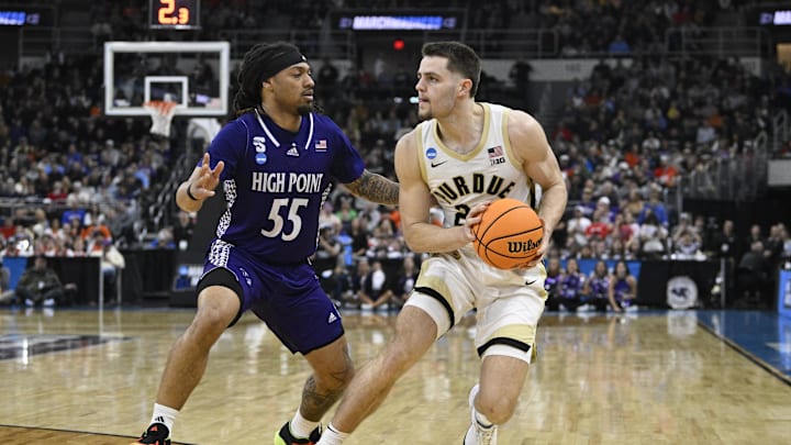 Mar 20, 2025; Providence, RI, USA; Purdue Boilermakers forward Camden Heide (23) controls the ball against High Point Panthers guard Bobby Pettiford (55) during the second half at Amica Mutual Pavilion. Mandatory Credit: Eric Canha-Imagn Images