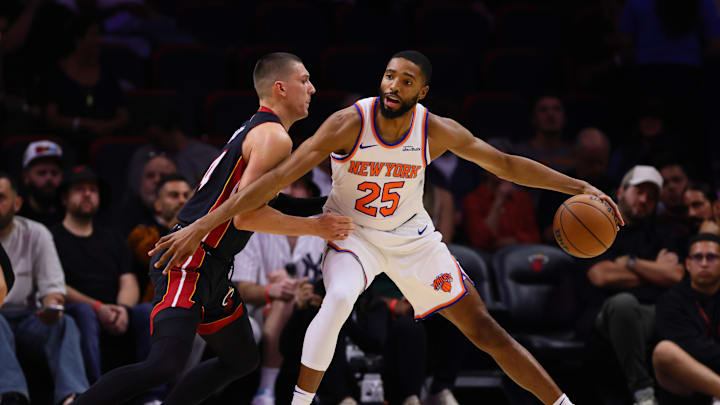 New York Knicks forward Mikal Bridges protects the basketball from Miami Heat guard Tyler Herro. Mandatory Credit: Sam Navarro-Imagn Images
